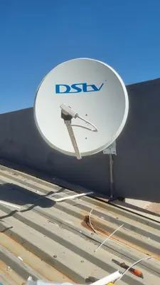 DStv satellite dish mounted on corrugated metal roof